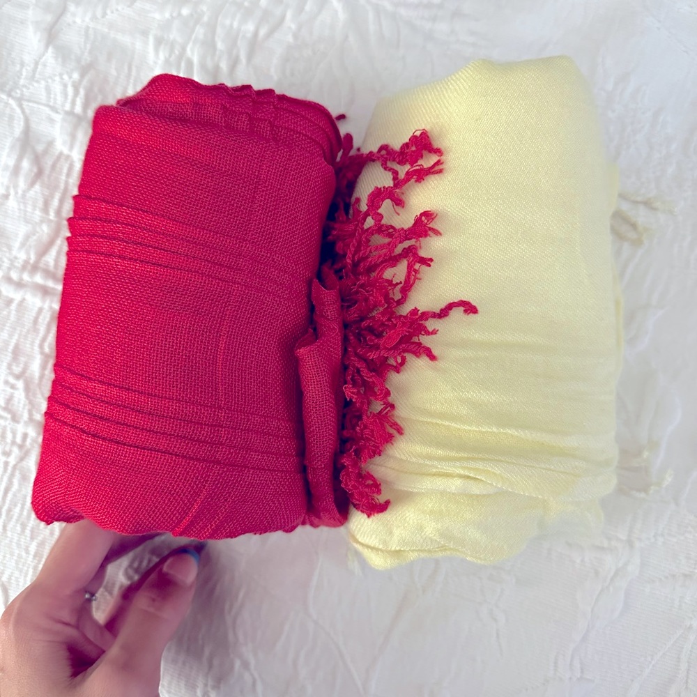 Two scarves or shawls.